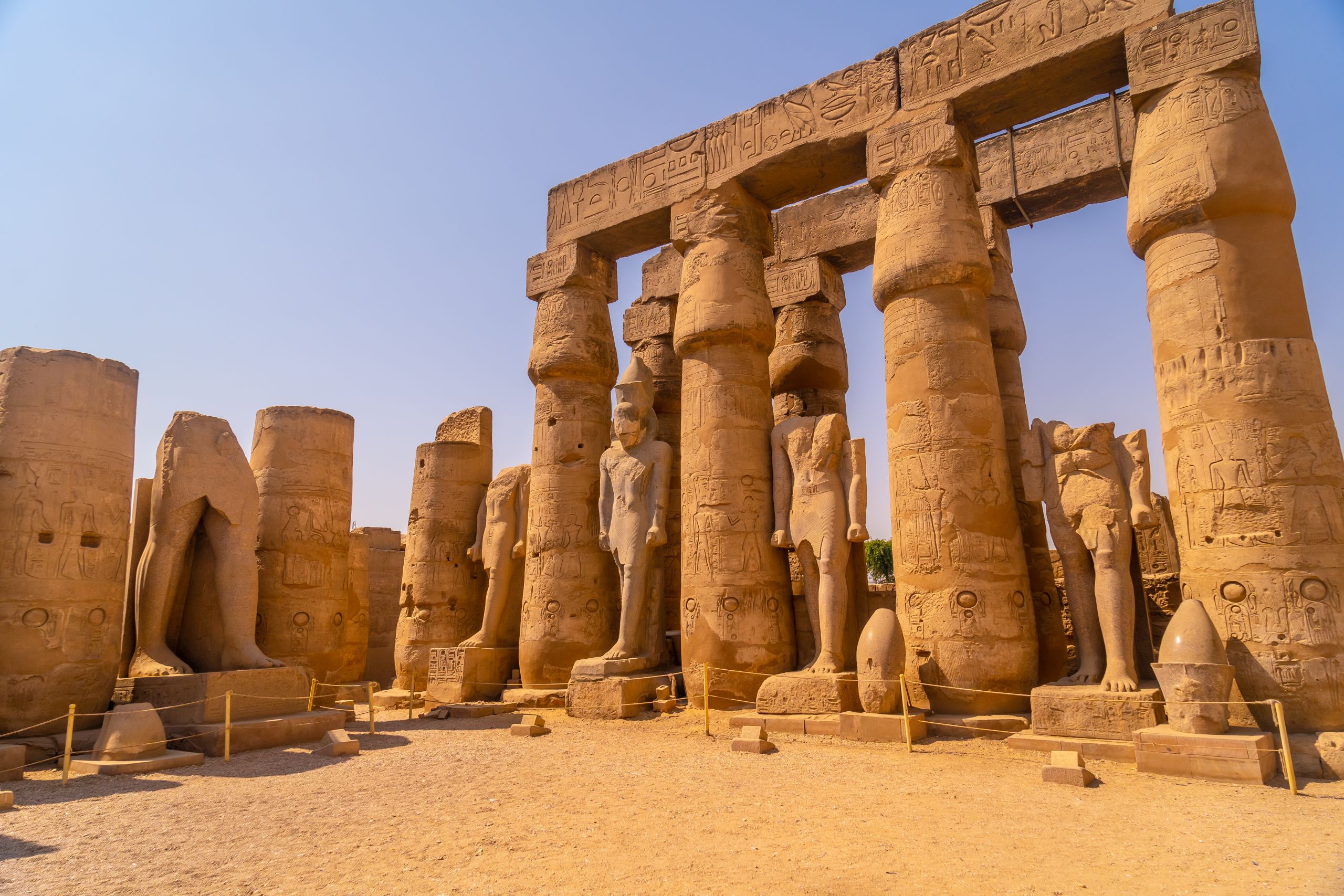 Sculptures of pharaohs and ancient Egyptian drawings on the columns of the Luxor Temple